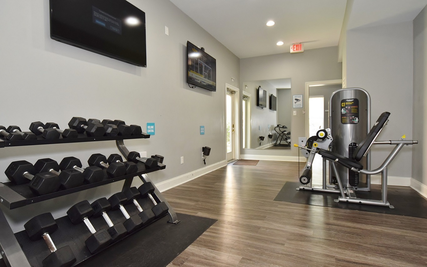 Fitness center with free weights at Oakbrook Apartments