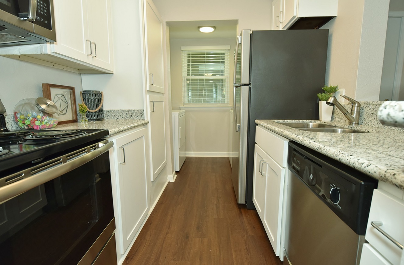 Kitchen with stainless steel appliances at Oakbrook Apartments
