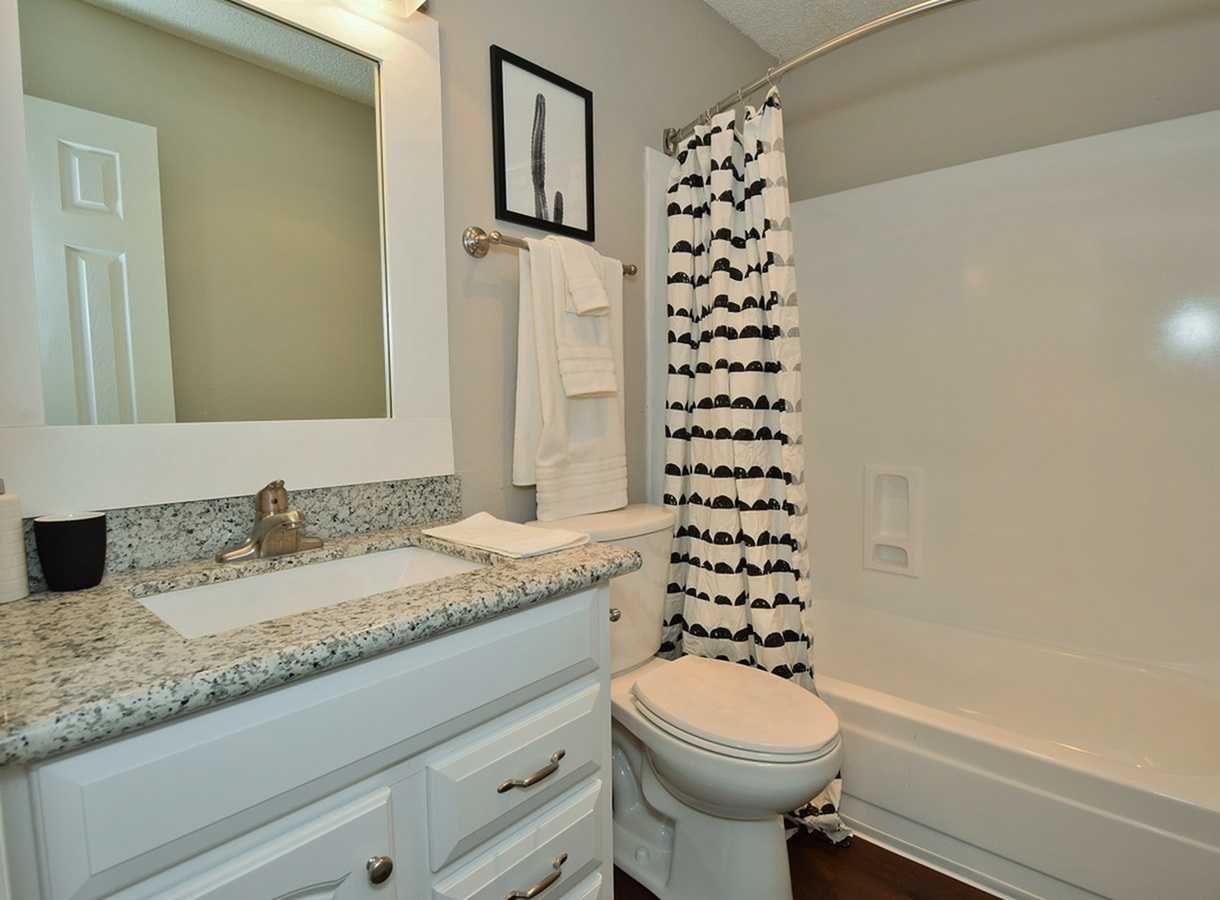Model bathroom with oversized vanity at Oakbrook Apartments
