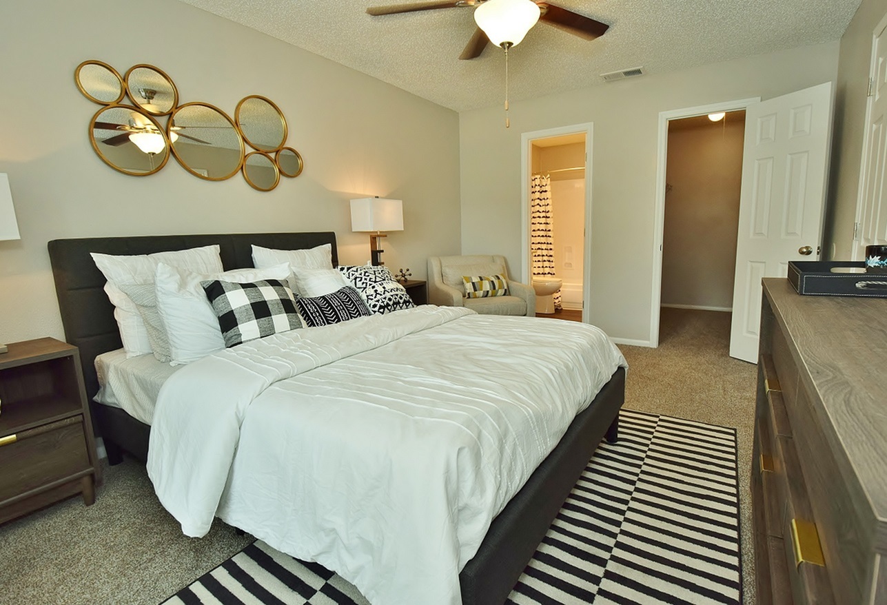 Model bedroom with attached bathroom at Oakbrook Apartments