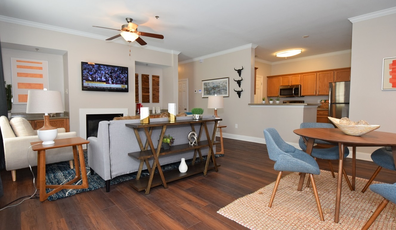 Model living room and dining area of an apartment at Oakbrook Apartments