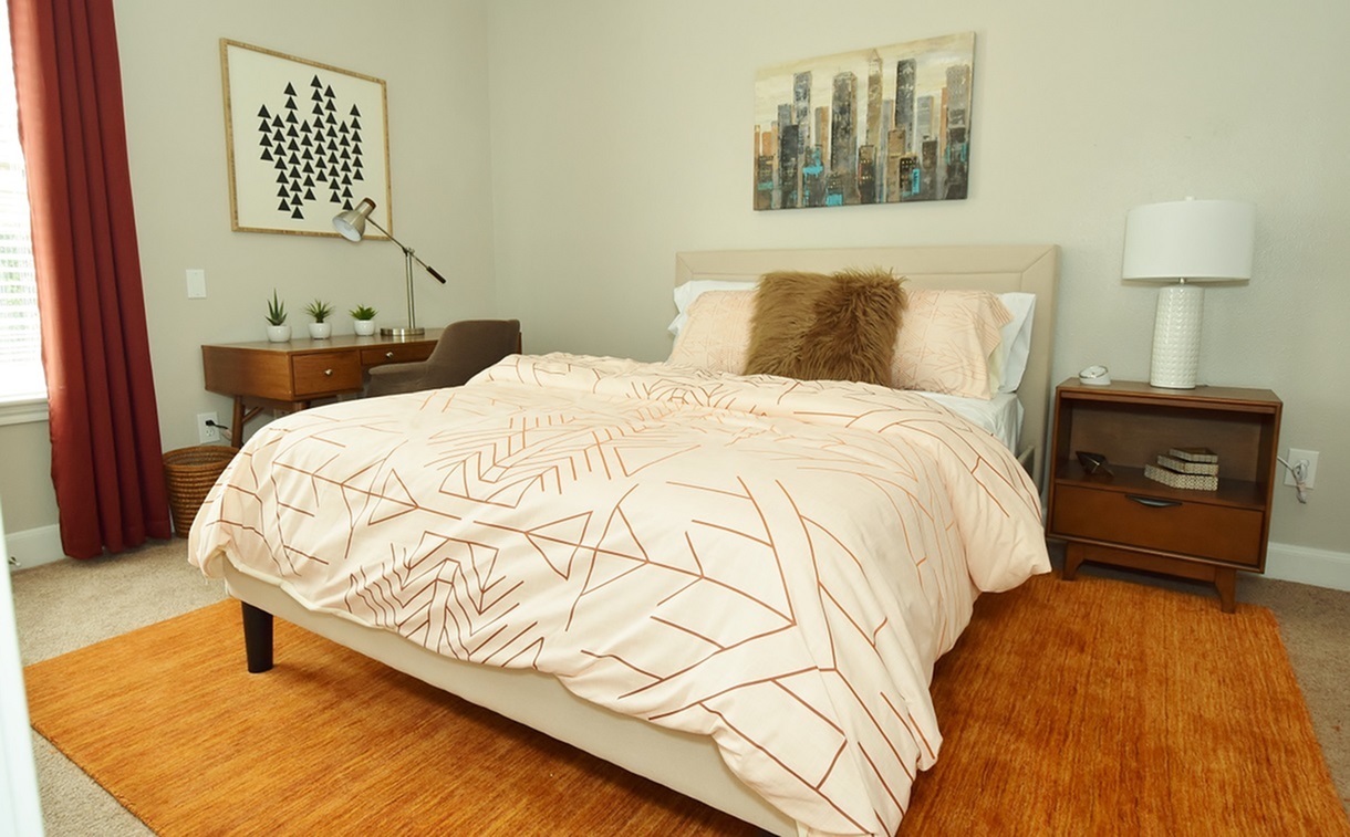 Spacious model bedroom with a large window